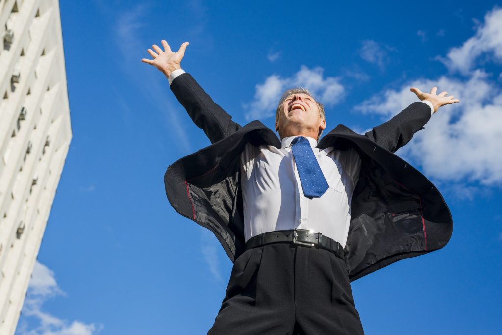 happy man and reaching for the sky