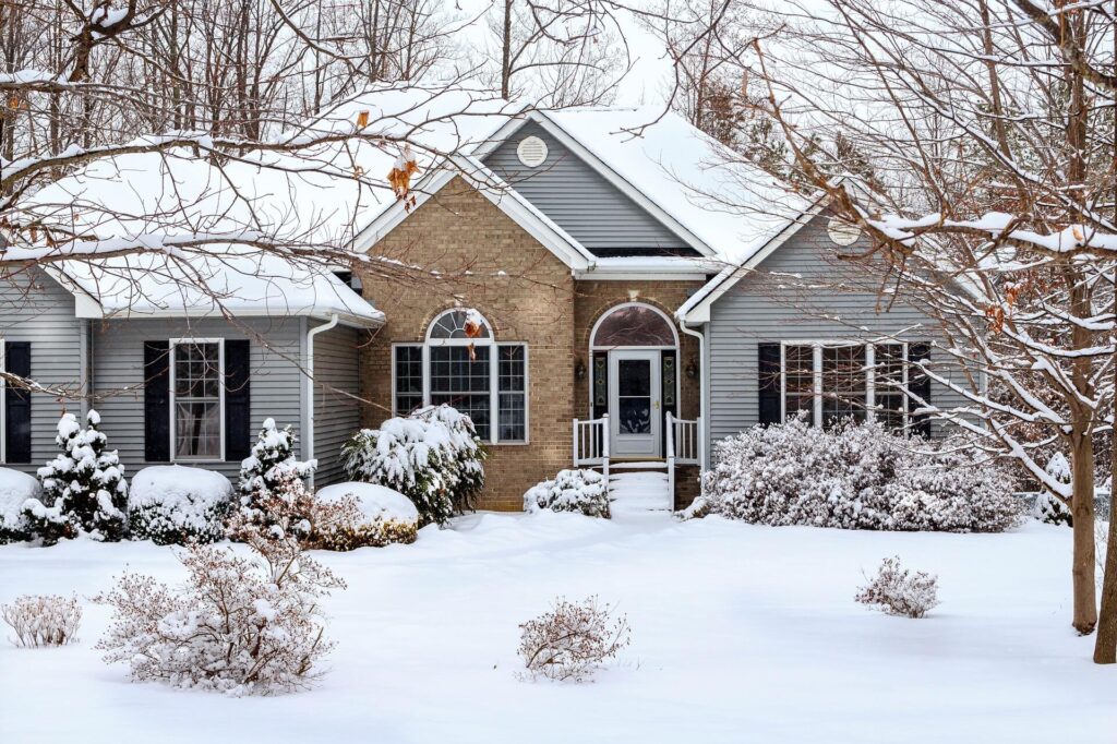 home with snow in winter