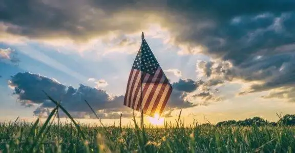 flag of USA on grass field