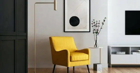 brown wooden framed yellow padded chair